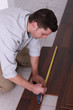 Man using a measuring tape