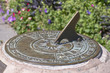 Old bronze sundial and shadow