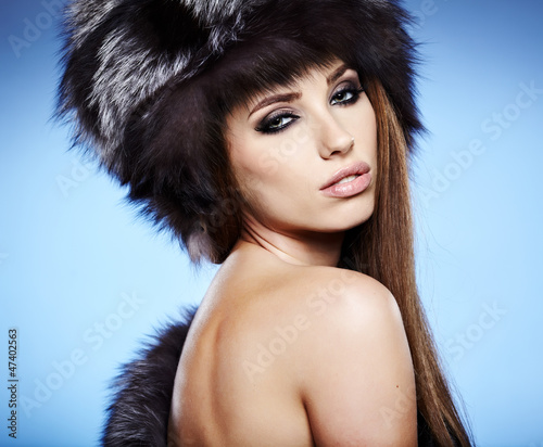 Photo: Fur Fashion. Beautiful Girl in Fur Hat. Winter Woman Portrait Fur Fashion. Beautiful Girl in Fur Hat. Winter Woman Portrait