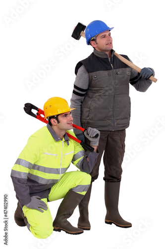 Photo: A team of labourers staring off into the distance A team of labourers staring off into the distance