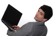 Businessman holding laptop