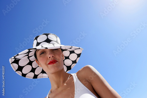 Photo: Portrait of woman with hat by summertime Portrait of woman with hat by summertime