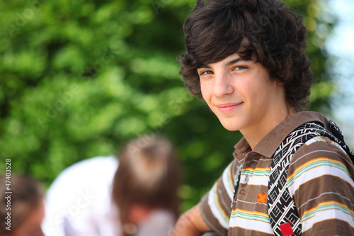 Photo: Teenage boy in the schoolyard Teenage boy in the schoolyard