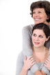 Mother and daughter hugging