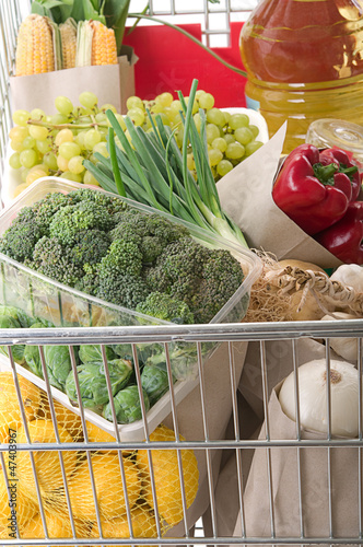 Photo: Close up of shopping trolley full of grocery Close up of shopping trolley full of grocery