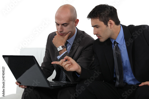 Photo: Two businessmen exchanging thoughts Two businessmen exchanging thoughts