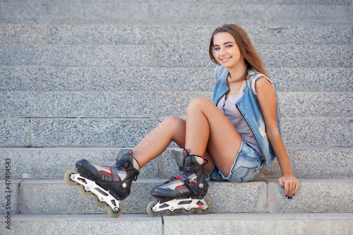 Photo: smiling girl sitting on the stairs smiling girl sitting on the stairs