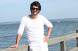 portrait of handsome young man at sea resort