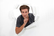 Man making shush gesture
