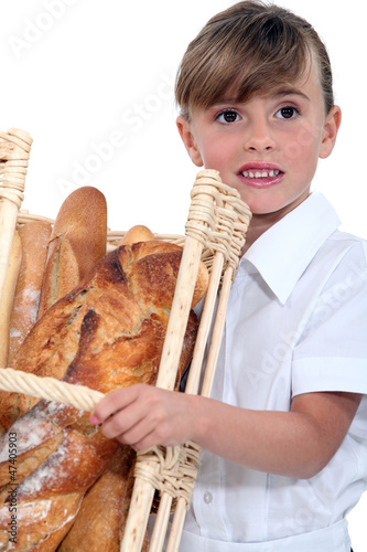 Photo: Little girl with basket of bread Little girl with basket of bread