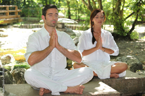 Photo: Couple doing relaxation exercises Couple doing relaxation exercises