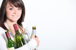 Young woman taking out the recycling