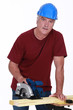 Carpenter with a circular saw