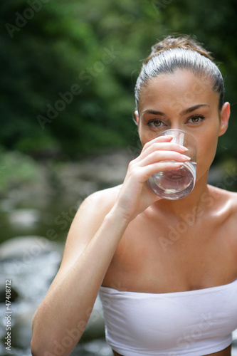 Photo: Brunette drinking glass of water Brunette drinking glass of water