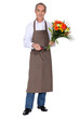 Male florist with a bunch of flowers