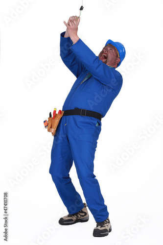 Photo: clumsy laborer getting electrocuted clumsy laborer getting electrocuted