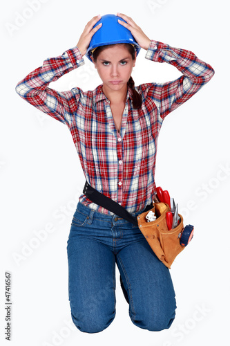 Photo: Stressed female builder Stressed female builder