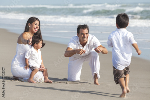 Photo: Mother, Father & Children Hispanic Family At Beach Mother, Father & Children Hispanic Family At Beach