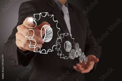 Photo: businessman hand show gear to success businessman hand show gear to success