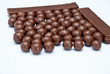 Photo: Dark brown Chocolate balls and sticks Dark brown Chocolate balls and sticks