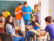 Group student in classroom near blackboard.