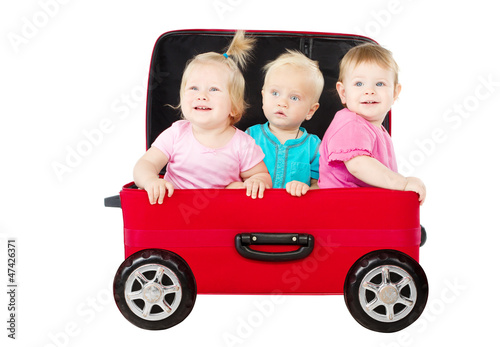 Photo: Group of kids driving in travel suitcase car Group of kids driving in travel suitcase car