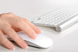 Woman's  hands using mouse and keyboard
