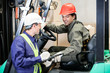 Photo: Forklift Driver Communicating With Supervisor Forklift Driver Communicating With Supervisor