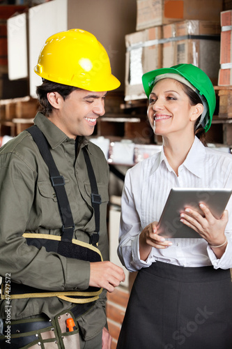 Photo: Supervisor With Digital Tablet And Foreman At Warehouse Supervisor With Digital Tablet And Foreman At Warehouse