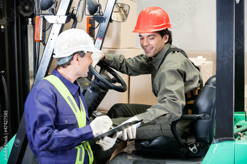 Photo: Forklift Driver Communicating With Supervisor Forklift Driver Communicating With Supervisor