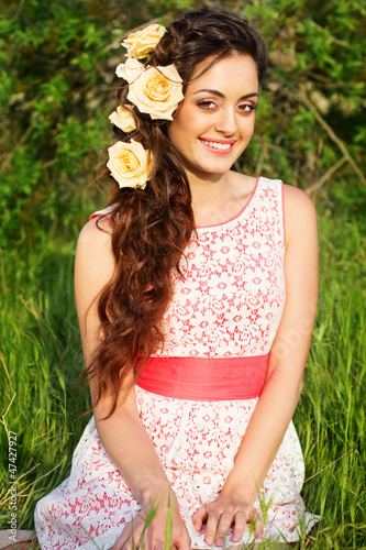 Photo: Beautiful woman with flowers in her hair Beautiful woman with flowers in her hair