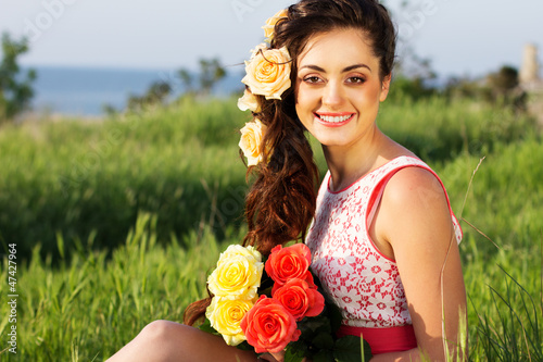 Photo: Beautiful woman with flowers in her hair Beautiful woman with flowers in her hair