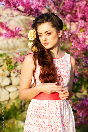 Photo: Beautiful woman with flowers in her hair Beautiful woman with flowers in her hair