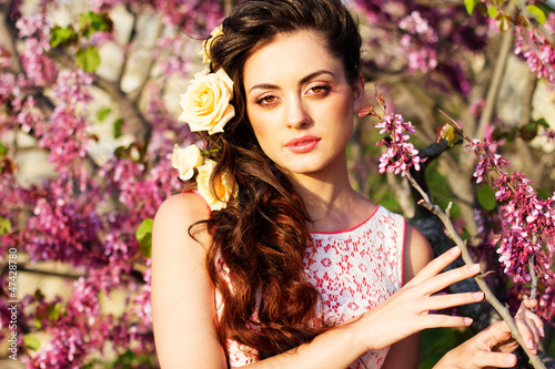 Photo: Beautiful woman with flowers in her hair Beautiful woman with flowers in her hair