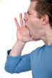 young man in profile shouting