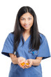 Portrait of a beautiful smiling nurse giving you pills
