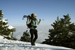Hiker in winter mountains snowshoeing