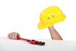 Man showing helmet and vernier caliper