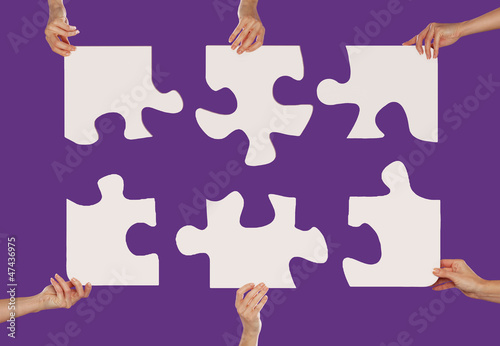 Photo: Hands and puzzle Hands and puzzle