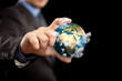 Businessman holding the world