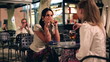 Video: Two female friends sitting in the restaurant in the evening Two female friends sitting in the restaurant in the evening