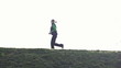 Man and woman jogging outdoors, super slow motion