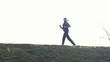 Man and woman jogging outdoors, super slow motion