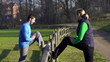 Young happy couple exercising outdoors, crane shot
