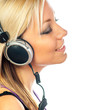 Beautiful teenage girl listens to music through the headphones