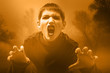 Teenage vampire in the misty forest preparing to attack