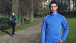 Portrait of young jogger in park, crane shot