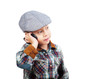 boy in a cap on the phone