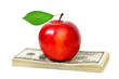 apple and dollars isolated on white background