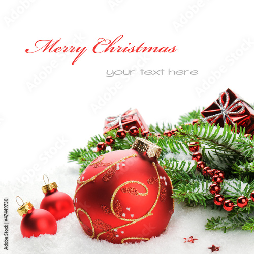 Photo: Christmas balls and fir branches with decorations Christmas balls and fir branches with decorations